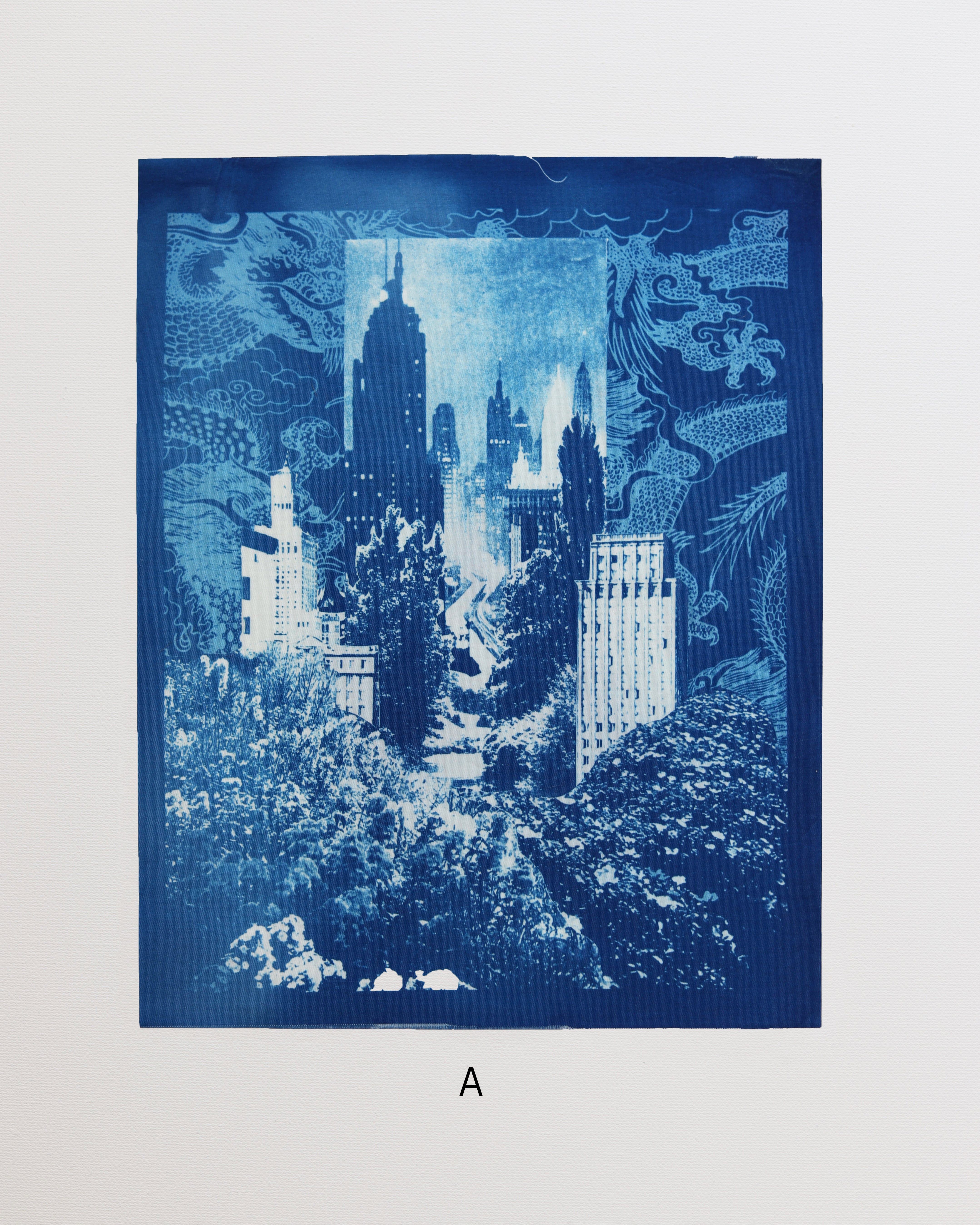 Blue cityscape cyanotype print with trees and buildings on a white background