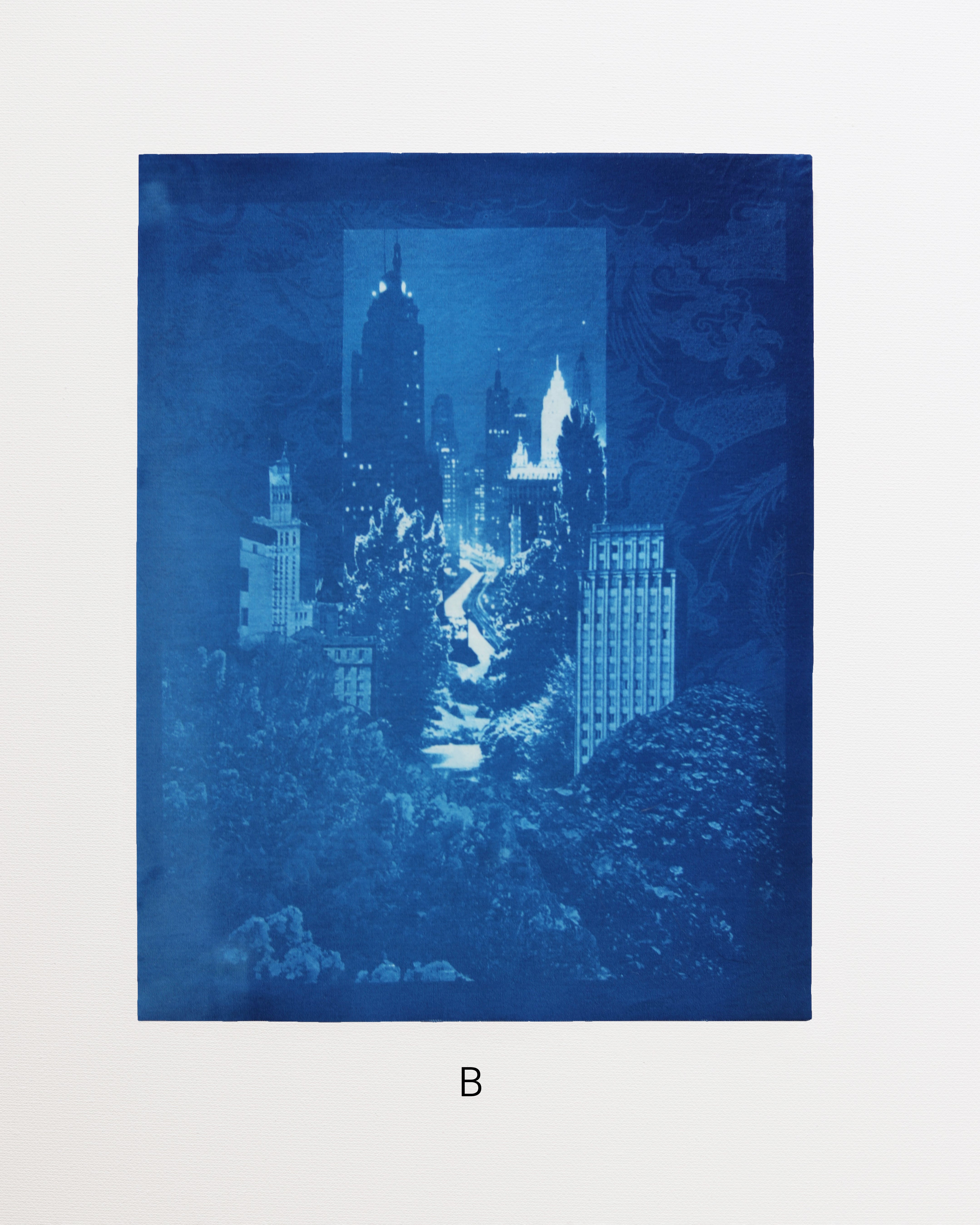 Blue cityscape cyanotype print with trees and buildings on a white background